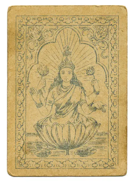 This Hindu goddess with four arms is Lakshmi, the Hindu goddess of wealth and fortune. As here, she is usually shown sitting in a lotus flower (water lily) and also holding them in her hands. Thus, the lotus flower is a symbol of purity and enlightenment amid ignorance. This playing card has square corners, typical of the mid- to late-19th century. Ravi Varma Press began in 1892 but was aready deep in debt by 1899. The press was sold and the factory went up in flames in 1972.