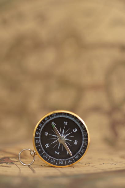 istock Compass on blur vintage map background, retro color tone, direction journey planning concept, copy space 1096508184