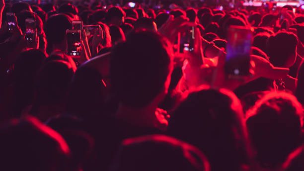 istock abstract colorful background audience in public concert. 1096517824