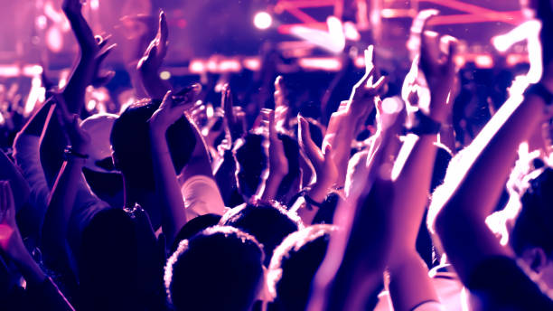 istock abstract colorful background audience in public concert. 1096517838