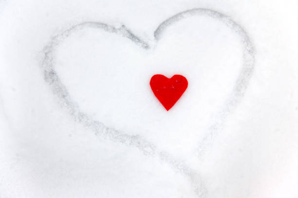 istock Red heart on the snow white background 1096519070