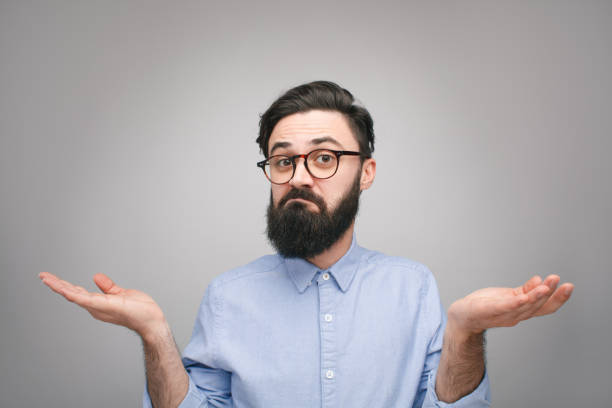 istock Confused man holding hands apart 1096522248