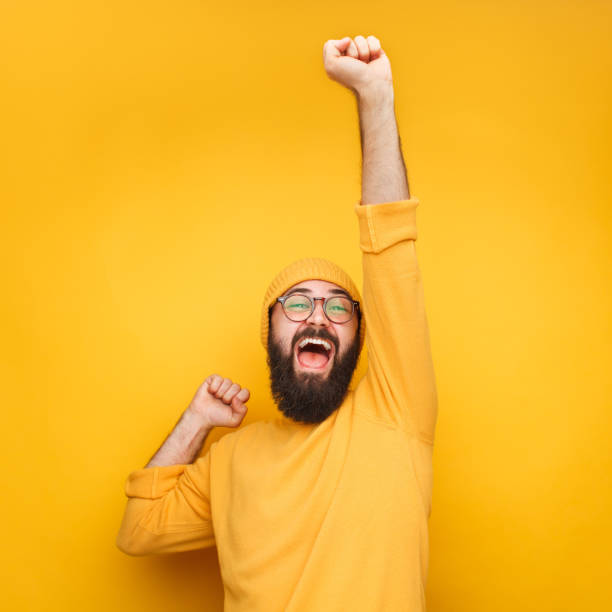 istock Celebrating bearded man with hand up 1096522276