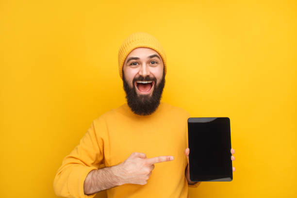 istock Stylish young man promoting tablet 1096522288