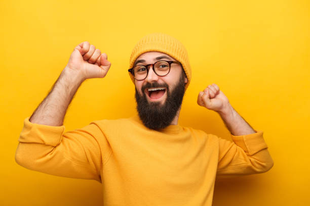 istock Cheerful bright hipster in yellow sweater 1096522330