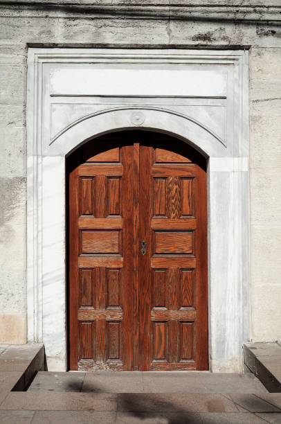 istock old shabby double light brown door 1096523196