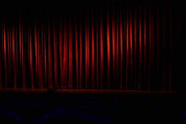 Close Theatrical stage Theatrical stage is closed by red curtain. stage curtain up stock pictures, royalty-free photos & images