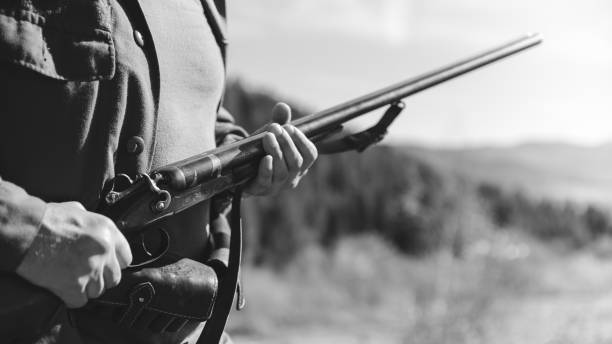 istock Hunter with horizontal double-barreled shotgun on hunting 1096539292