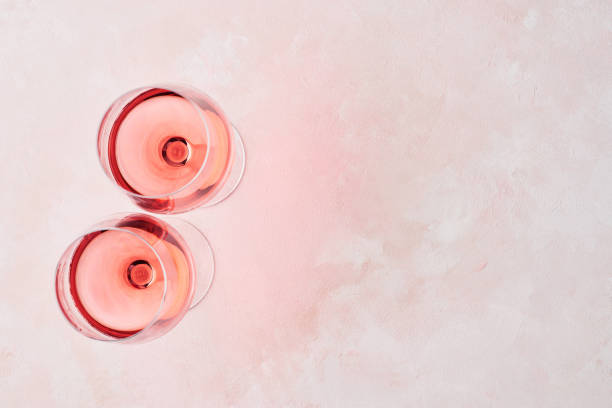 istock Glass of rose wine on pink background 1096542474