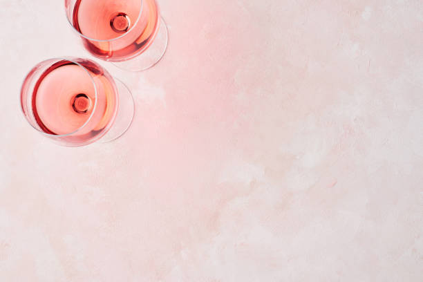 istock Glass of rose wine on pink background 1096542522