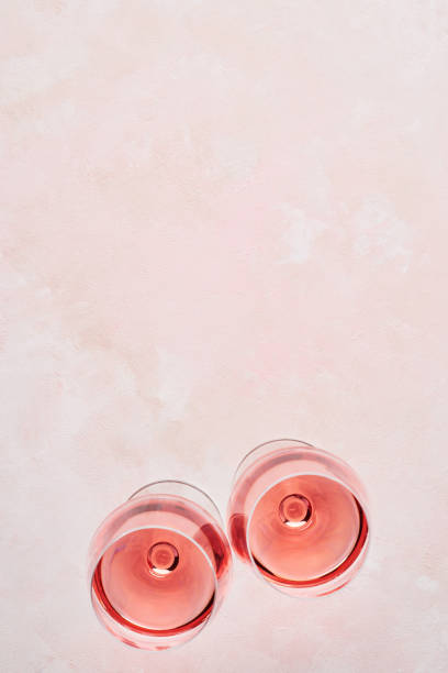 istock Glass of rose wine on pink background 1096542524