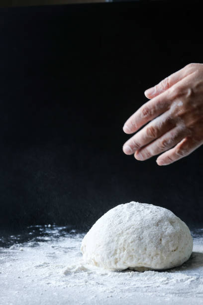 istock making dough with flour by female hands 1096545444