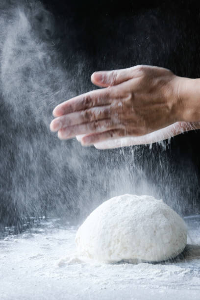istock making dough with flour by female hands 1096545450