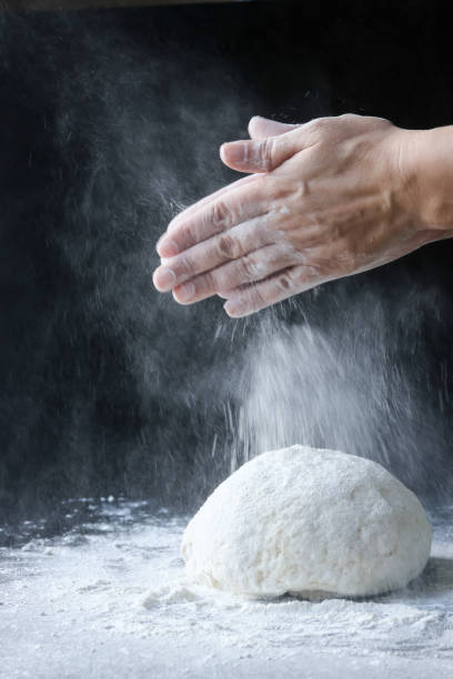 istock making dough with flour by female hands 1096545454