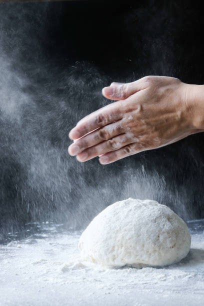 istock making dough with flour by female hands 1096545456