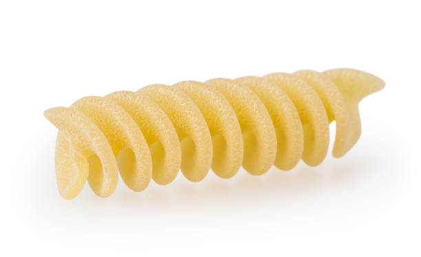 istock Uncooked fusilli pasta isolated on white background with clipping path 1096545664