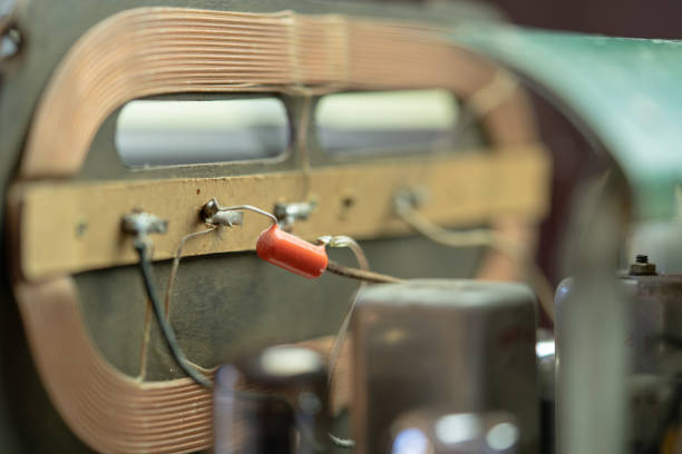Close up of two old vintage retro radio tubes old components of obsolete radio on white background as concept for obsolete technology