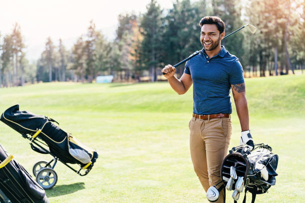 istock Smiling golfer with club and bag 1096549664