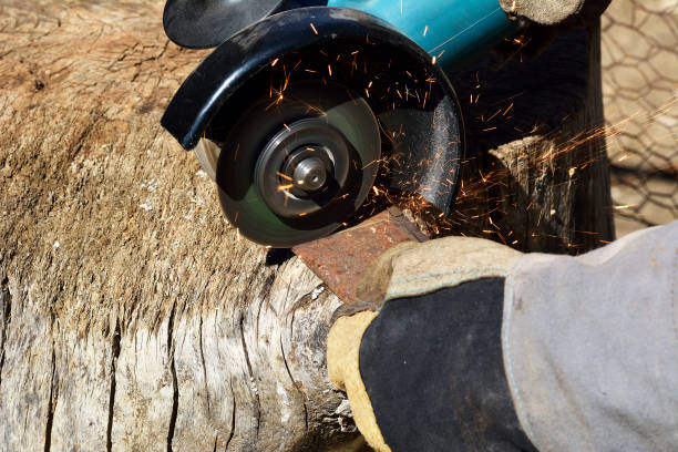 istock Electric grinder. A man working with electric grinder tool on steel structure, sparks flying 1096552538