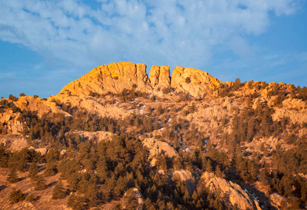 Horsetooth rock formation at sunrise is a distinctive geological and popular mountain landmark overlooking Fort Collins, Colorado, USA. Horsetooth rock formation at sunrise is a distinctive geological and popular mountain landmark and hiking trail overlooking Fort Collins, Colorado, USA. foothills photos stock pictures, royalty-free photos & images