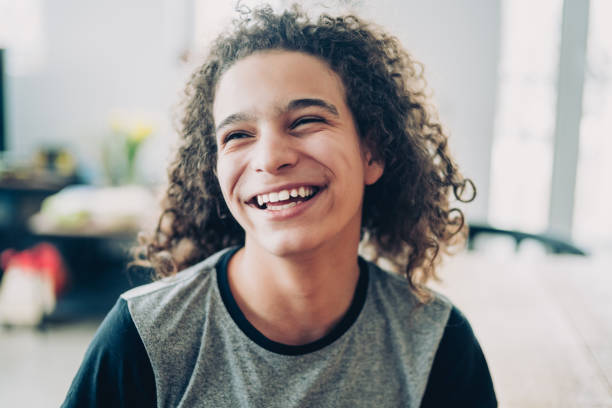 istock Curly teen laughing 1096570486
