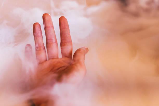 Liquid nitrogen with hand stock photo