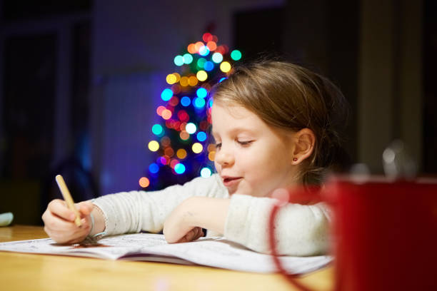 istock Inspired little girl at the table draw with crayons or do home work 1096590912