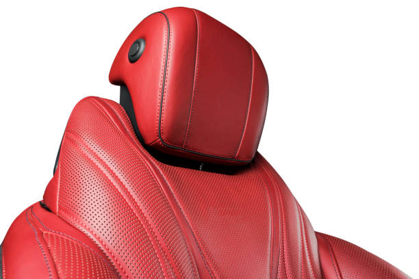 istock Red leather interior of a car. Perforated red leather comfortable seats with stitching isolated on white background. Car interior details. Car detailing. Car inside 1096606106