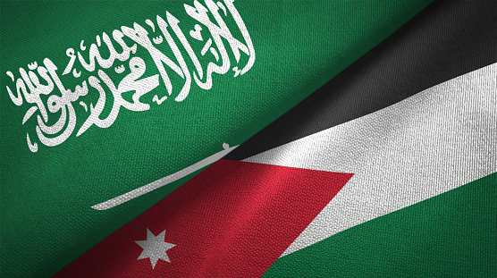 Jordania y Arabia Saudita paño de textil juntos dos banderas, textura de la tela photo