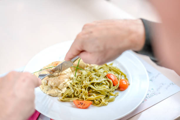 istock Man eating roasted  turkey meat  with bechamel sauce 1096609510
