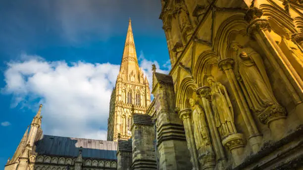 Intense Summer colors and a tourist perspective view of the Salisbury cathedral, Cathedral Church of the Blessed Virgin Mary. Salisbury is an Anglican cathedral in Wiltshire, Salisbury, England, UK.