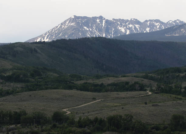 istock Dirt Road and Mountain Ridge 1096623190