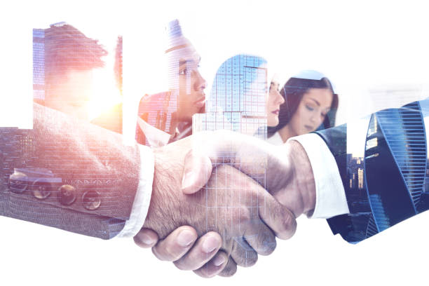 istock Handshake in morning city, business team 1096623678