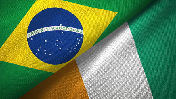 istock Cote d'Ivoire Ivory coast and Brazil two flags together textile cloth, fabric texture 1096625852