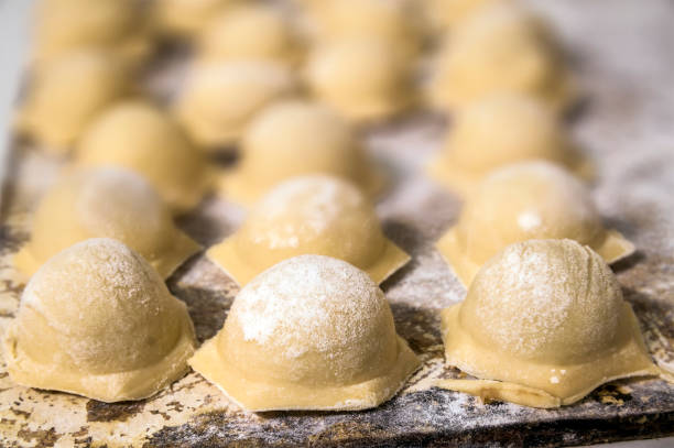 istock Preparing of raw dumplings in flour on the table 1096634874