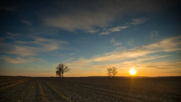istock Beautiful evening colorful sky over plowed fields 1096635426