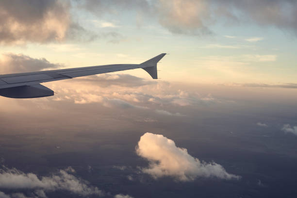 istock Airplane wing seen through a window at sunset. 1096645162