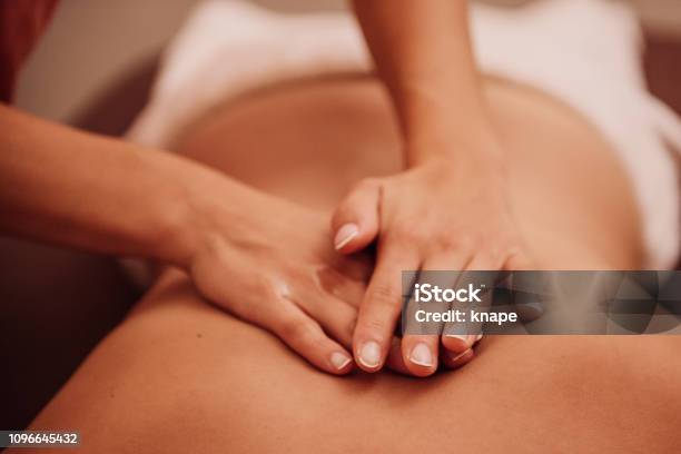 Woman Getting A Back Massage Stock Photo - Download Image Now - Massaging, Massage Therapist, Spa