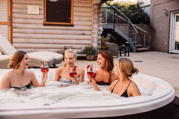 Group of young women having fun in hot tub whirlpool outdoors Group of young women having fun in hot tub whirlpool outdoors 
Bachelorette ladies night with women pool and drinks
Photo taken outdoors in natural sunlight in summer bachelorette party stock pictures, royalty-free photos & images