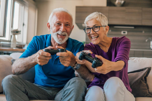 istock Senior couple playing video games 1096652428