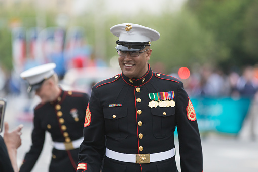 Louisville, Kentucky, USA - May 03, 2018: The Pegasus Parade, United States Marines walking down W Broadway, waving and saluting people