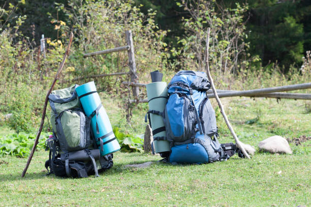 istock Two touristic hikers backpacks standing in a mountain valley on sunny day 1096653716