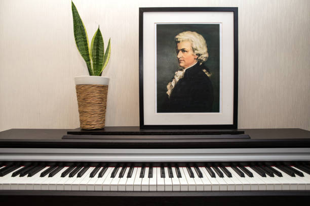 Wolfgang Amadeus Mozart - Portrait's photocopy of Burchard Dubeck painted in 1808 and piano keyboard. 11.28.2018, Paris, France, apartment. Wolfgang Amadeus Mozart's portrait photocopy of Burchard Dubeck painted in 1808 and piano keyboard in the flat. wolfgang amadeus mozart photos stock pictures, royalty-free photos & images