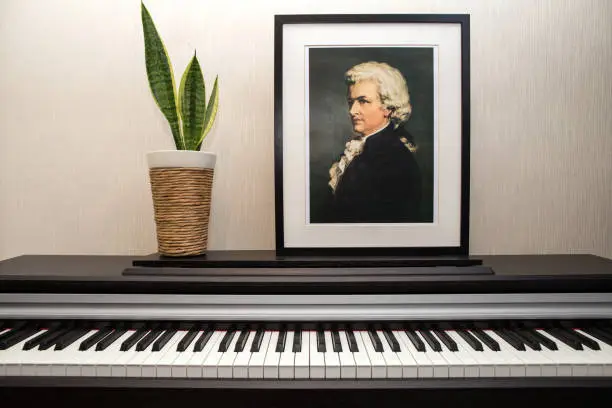 11.28.2018, Paris, France, apartment. Wolfgang Amadeus Mozart's portrait photocopy of Burchard Dubeck painted in 1808 and piano keyboard in the flat.