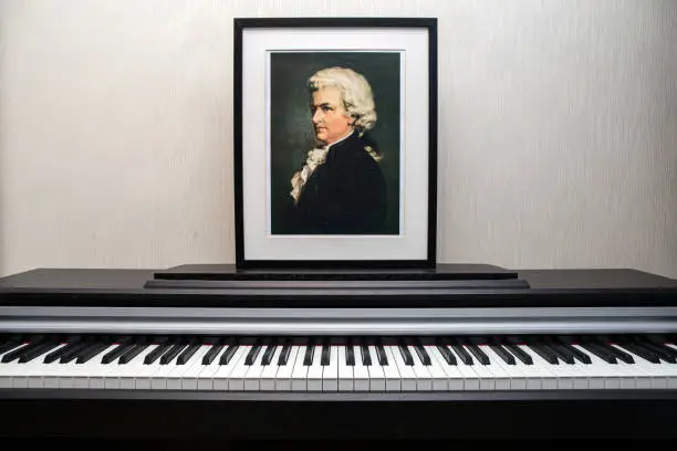 11.28.2018, Paris, France, apartment. Wolfgang Amadeus Mozart's portrait photocopy of Burchard Dubeck painted in 1808 and piano keyboard in the flat.