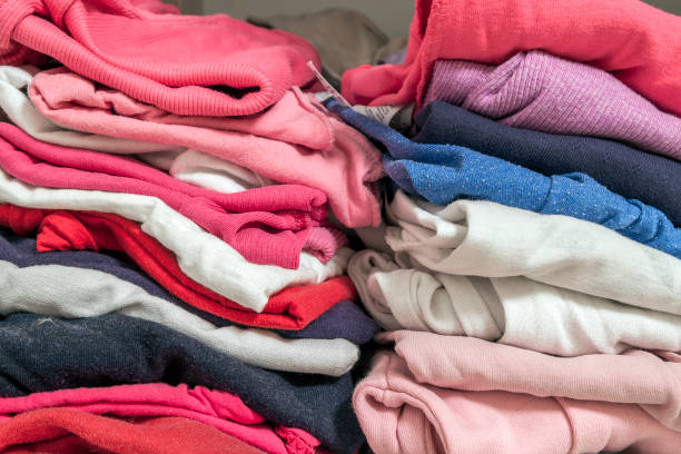 istock A stack of knitted warm woolen clothes in wardrobe close up 1096676848