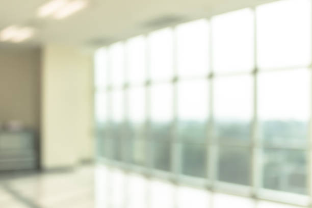 istock Blur background interior view looking out toward to empty office lobby and entrance doors and glass curtain wall 1096694250