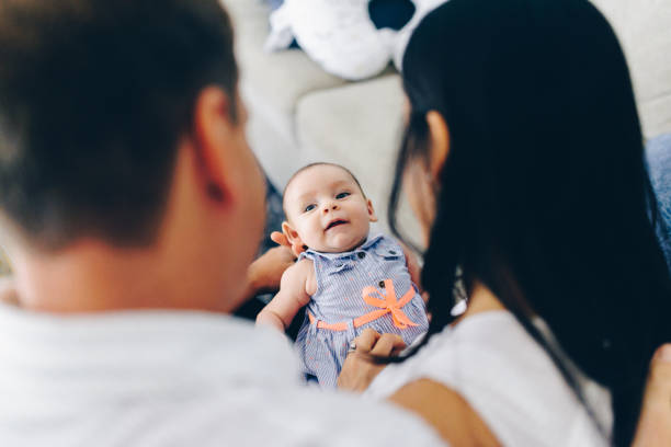 istock New baby at home with mom and dad 1096694400
