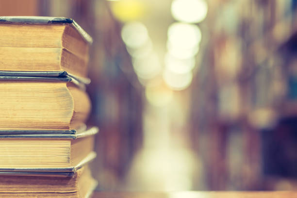 istock Book stack in library study room with bookshelf for business and education background, class learning and back to school concept 1096694676