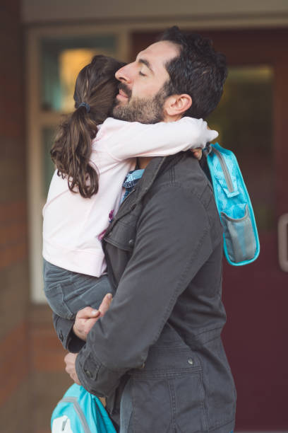 istock Dad drops little girl off at school 1096696244